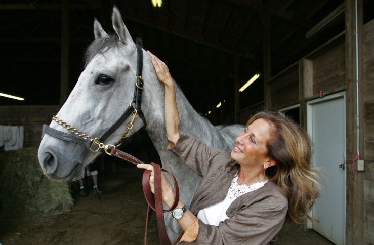Maggi Moss, a prominent figure in horse rescue and retirement, and also works against horse slaughter, will be inducted into the Prairie Meadows Hall of Fame August 6th. Shown here with her horse Temporary Saint, Moss has been the track's leading owner 8 of the last 10 years. Mary Chind/The Des Moines Register.