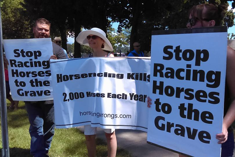 Protesters against horse racing wrongs at Saratoga racecourse, July 23, 2016.